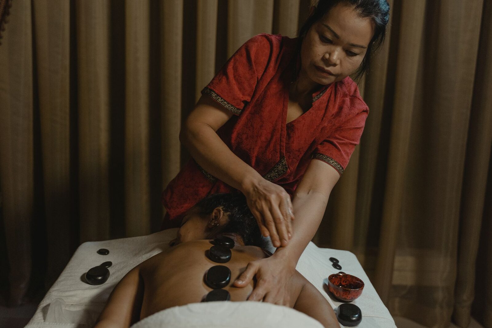 A hot-stone treatment at a legitimate spa.