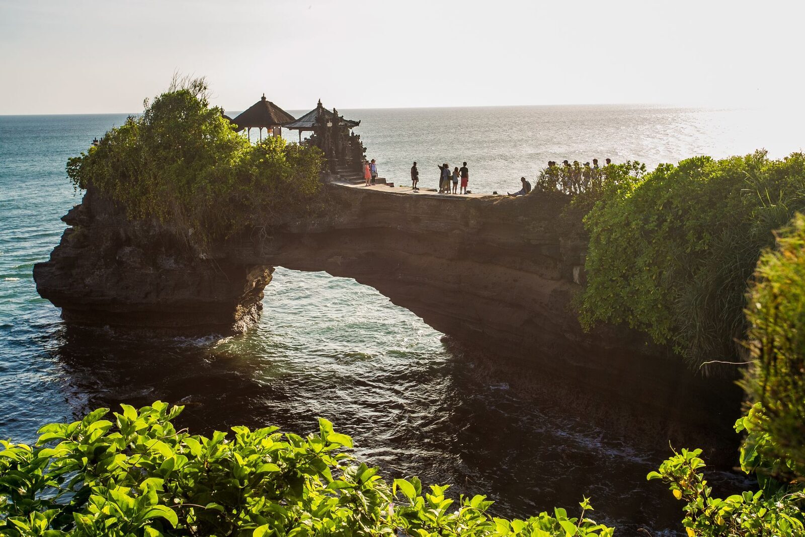 Visitors on the arch at Batu Bolong, a far less mobbed foreground for a Tanah Lot sunset.