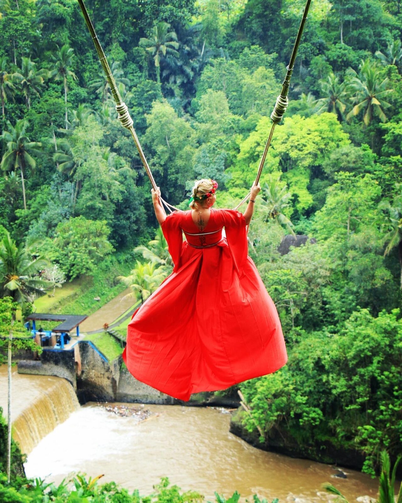 One of the rim's swings in full flight — the paid photo attraction that's separate from the terrace walk.