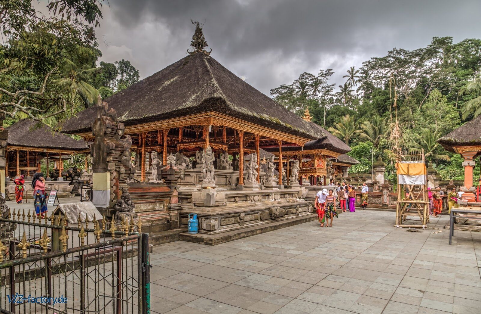 The courtyard pavilions with worshippers arriving in ceremonial dress — the real texture of the place.