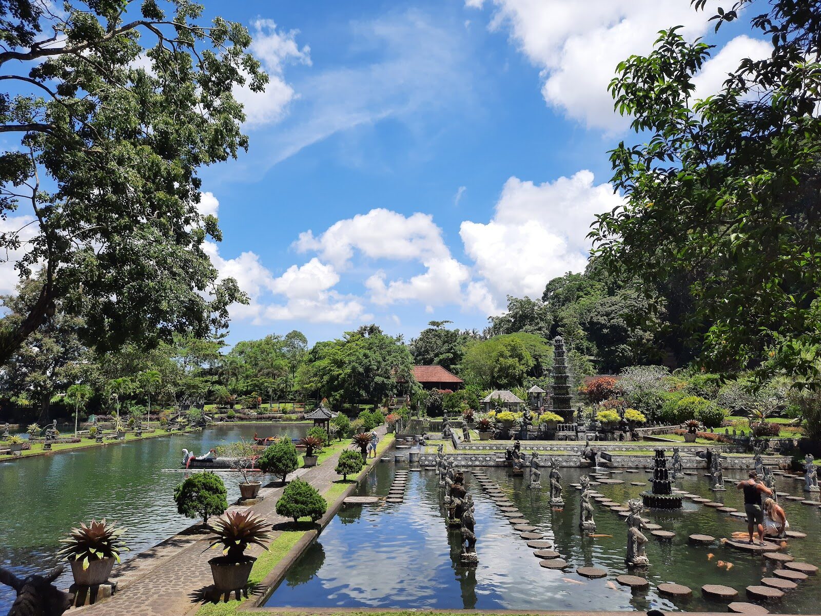 The fountain seen across the stepping-stone pond.