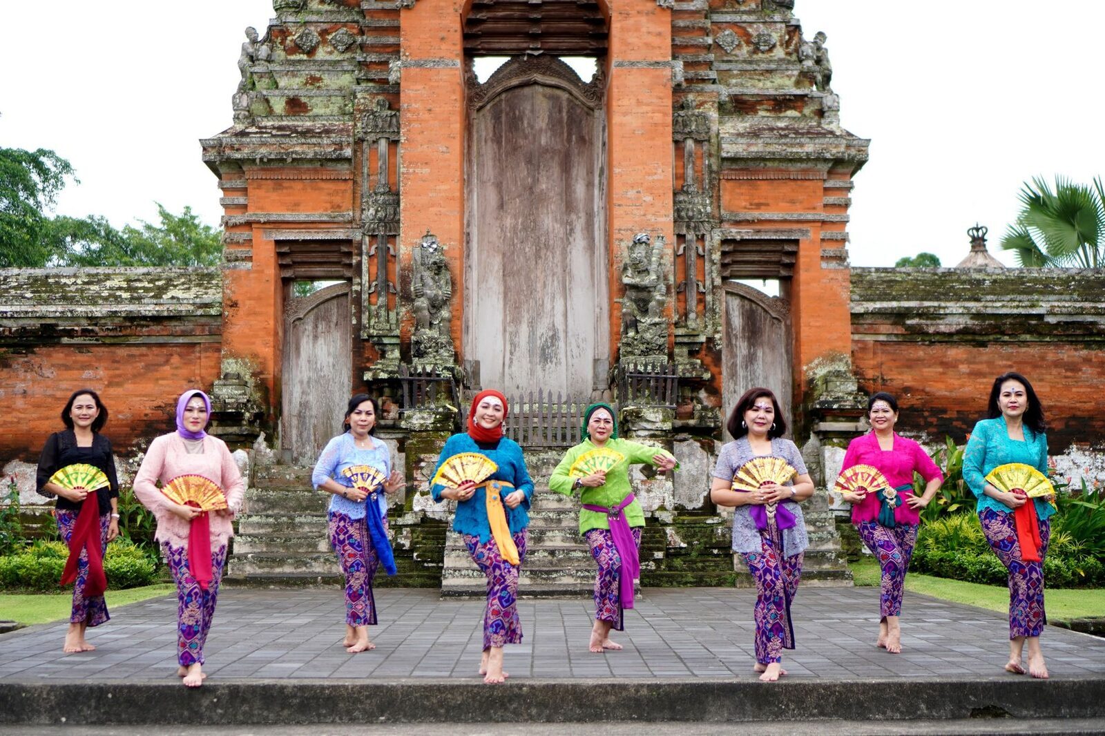Dancers with fans performing at Ubud — tickets fund the local troupes.