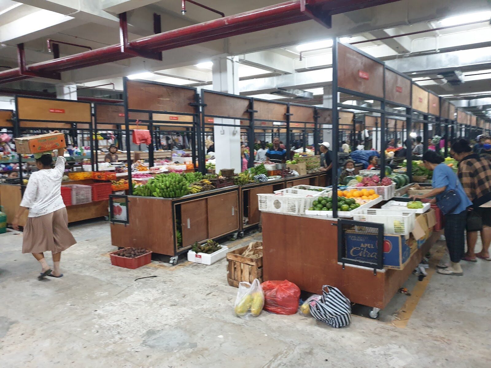 The traditional produce market hall — the working market locals actually use, best early.