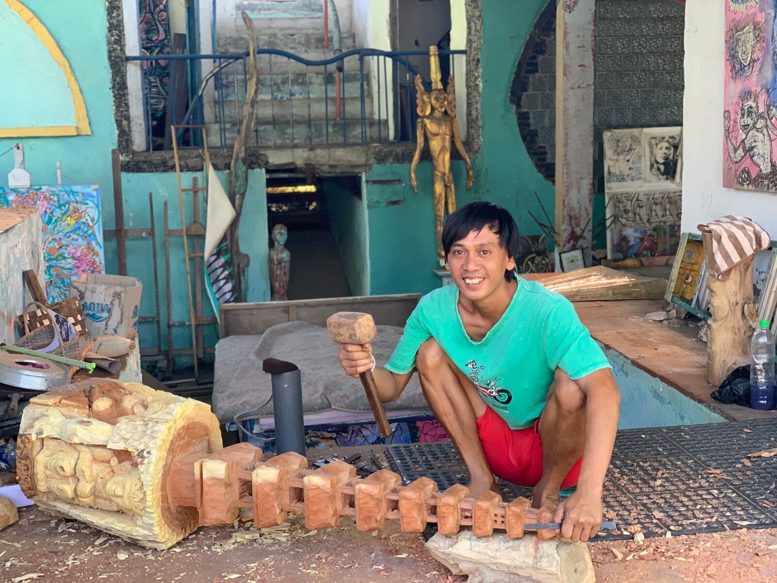 A vendor with carved-wood pieces — Mas and the villages around Ubud supply a lot of this.