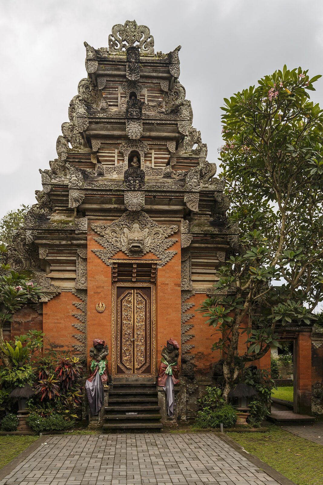 The palace's tall carved gate (candi) — the court art that sets Ubud apart from beach Bali.