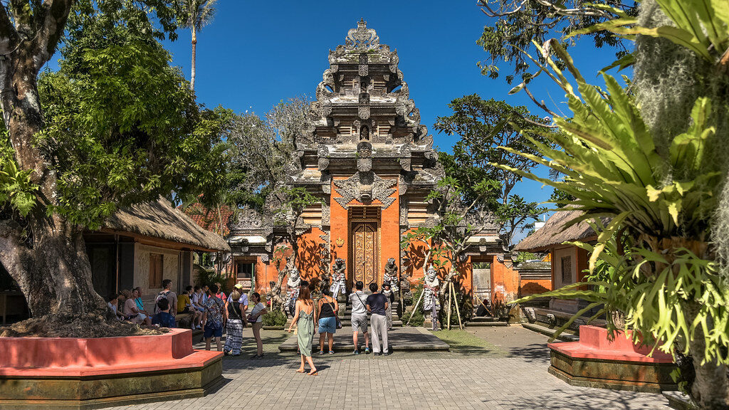 The palace courtyard under its banyan — open to wander in the daytime.
