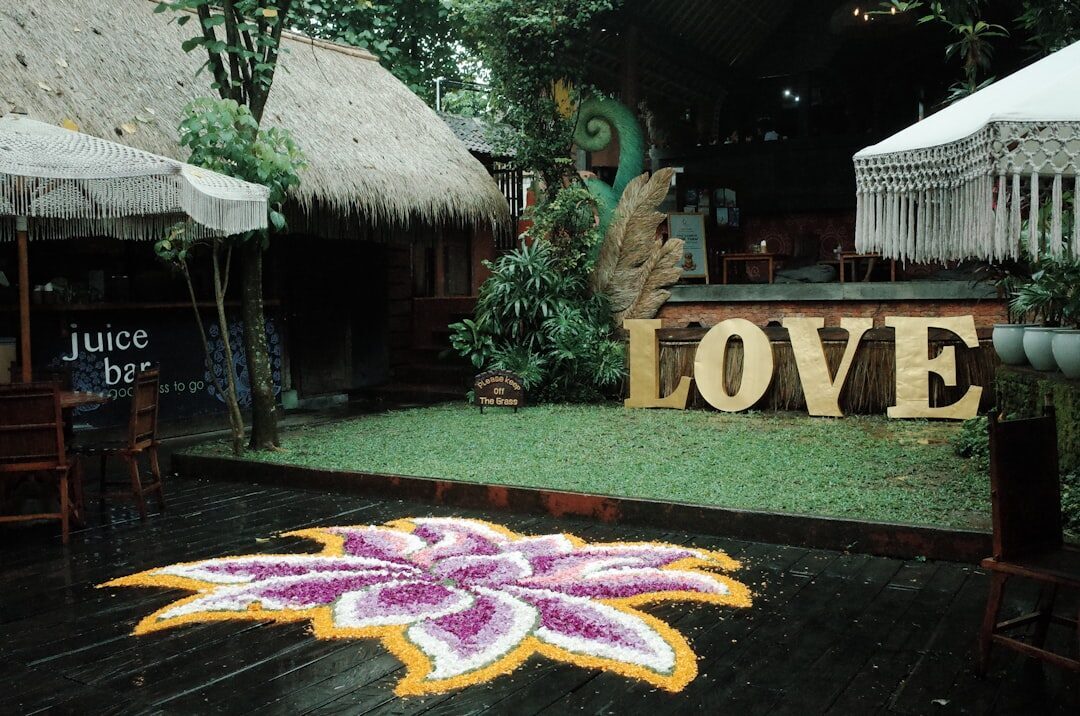 A 'LOVE' sign outside a juice bar — treat 'authentic' and 'healing' on a signboard as pricing signals, not descriptions.
