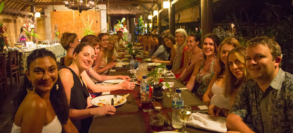 A long communal table at a café — the social side of the wellness crowd.