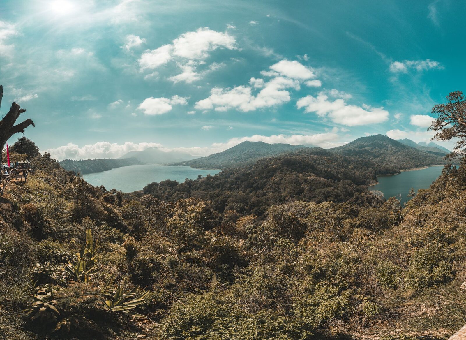 The twin-lake viewpoint north of Bedugul, looking down over Buyan and Tamblingan from the ridge — a free pullover on the Munduk road.