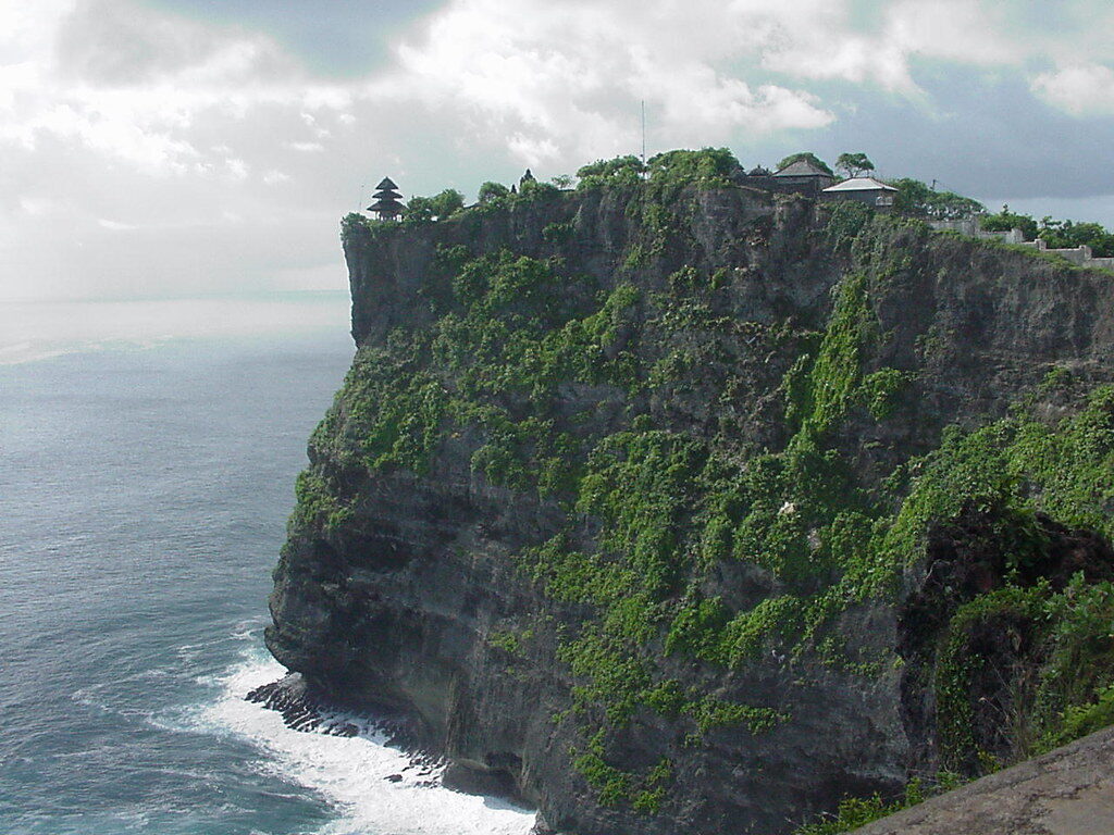 The sheer sea-cliff, the swell wrapping the point far below.