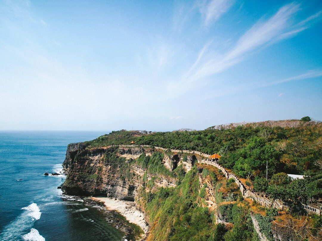 The clifftop path above the open ocean, the temple ahead.