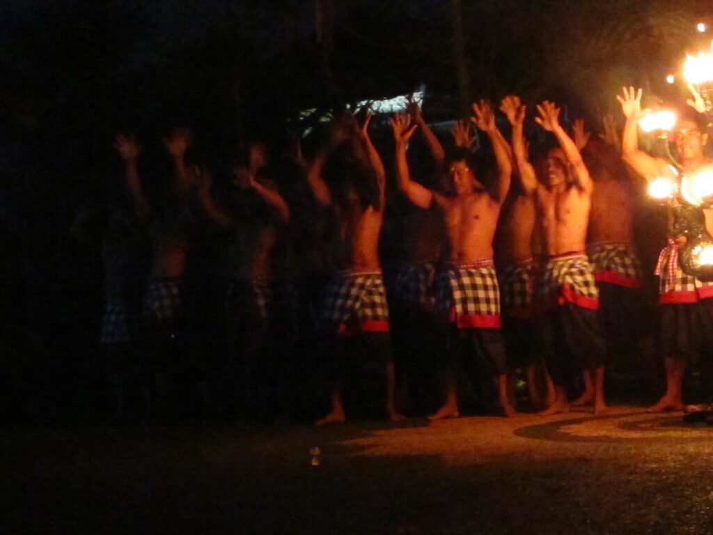 Arms thrown up in the dark as the chorus lands on the beat.