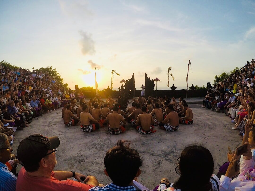 The clifftop circle at sunset, the sun dropping into the sea behind the chant.