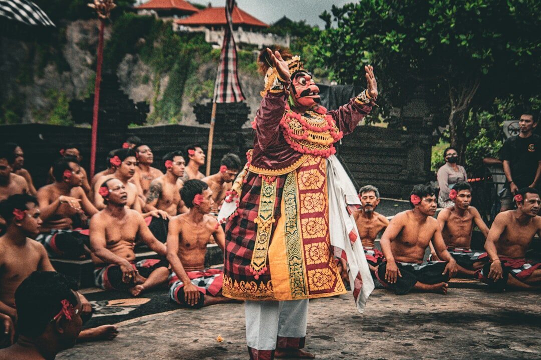 A crowned principal — Rama or Ravana — working the space inside the chorus.