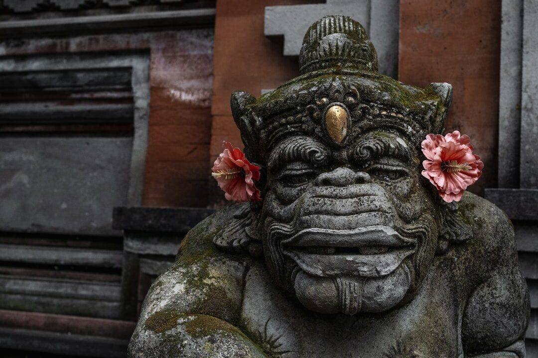 A grotesque guardian face — the bulging-eyed Bhoma (or Kala) that filters out negative forces at a Balinese gate. Not a demon: a protector.