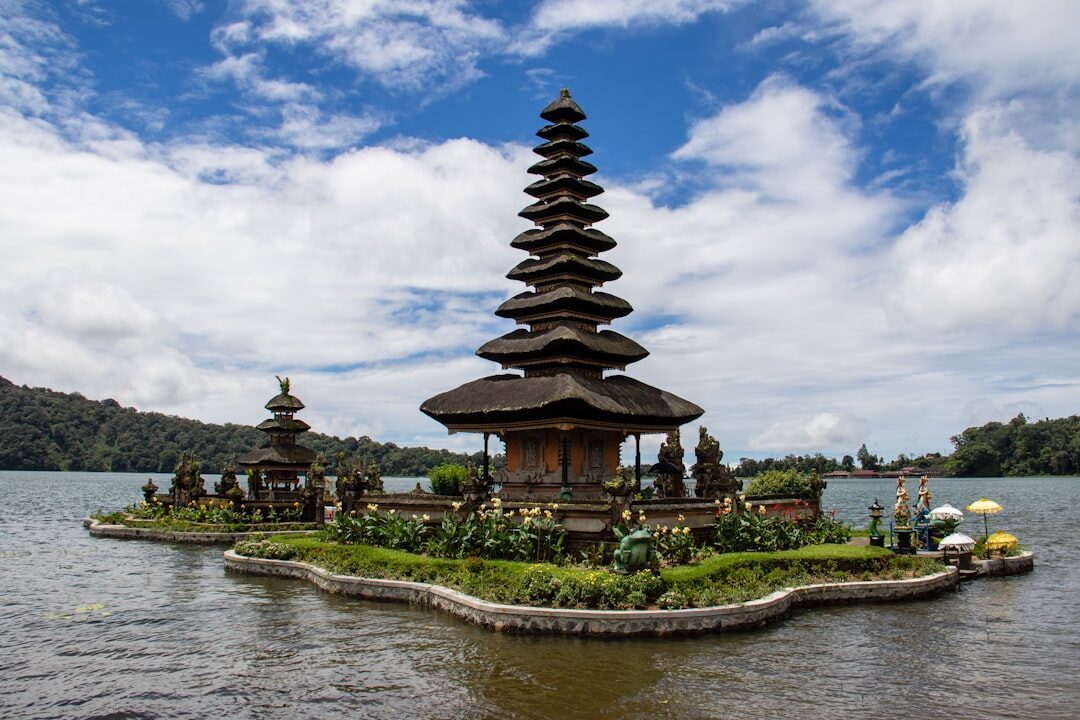 The many-tiered meru of Pura Ulun Danu on its lake — the towering pagodas you may be picturing, which are not what Uluwatu has.