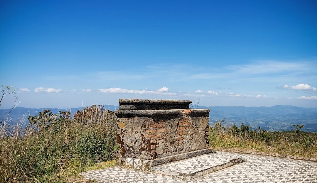 A simple stone shrine standing open to the sky — a general example of a Balinese seat-shrine of the kind the empty-throned padmasana belongs to.