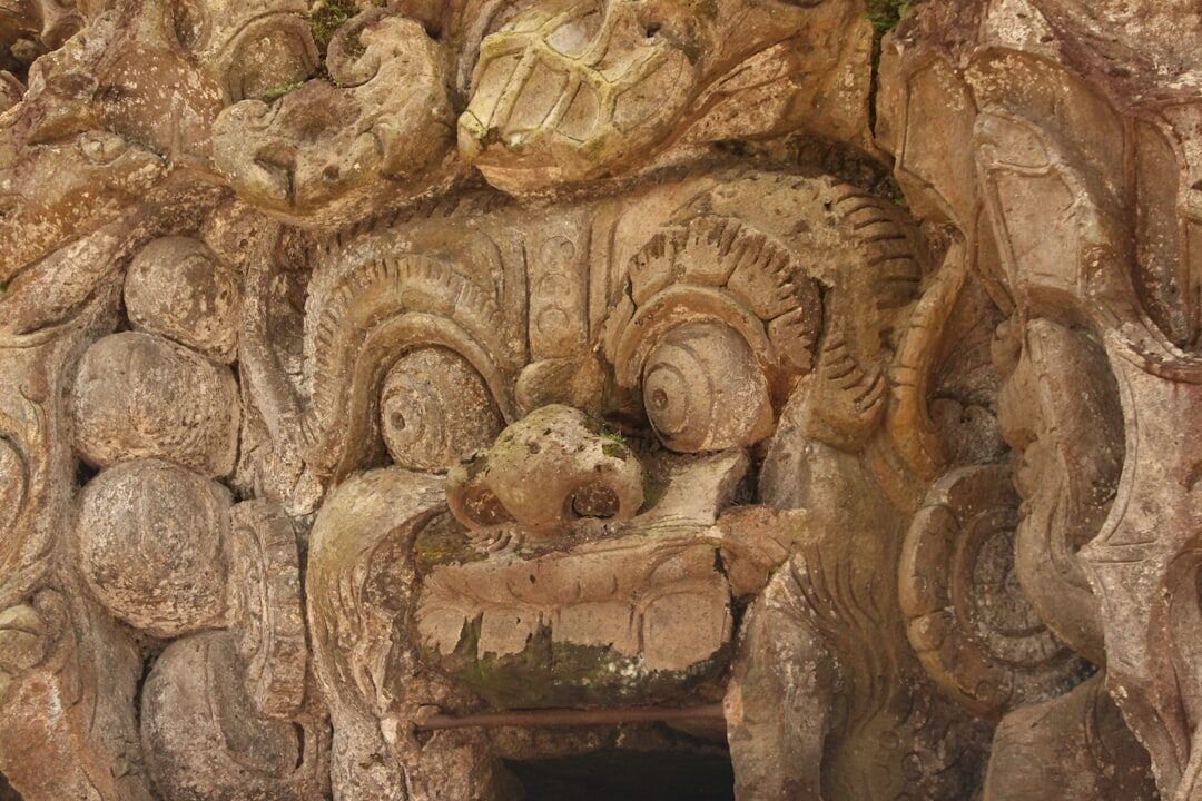 A warm-toned carved stone relief, deep-cut and well preserved.