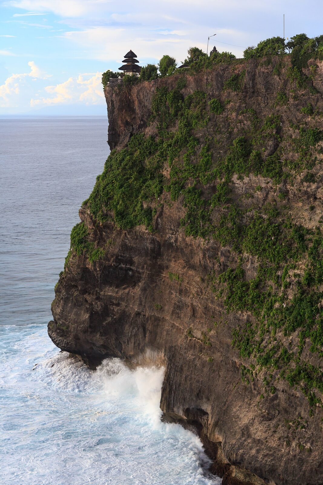 The sheer sea-cliff headland that Uluwatu temple sits atop.