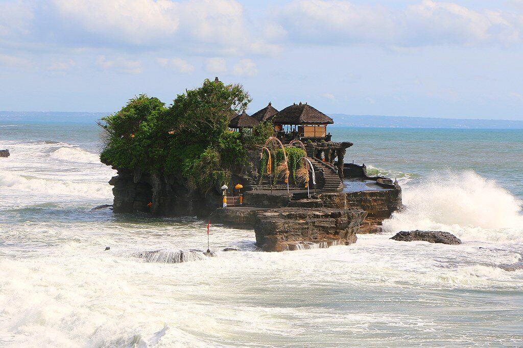 The temple and its cliff gardens above the surf at Tanah Lot.