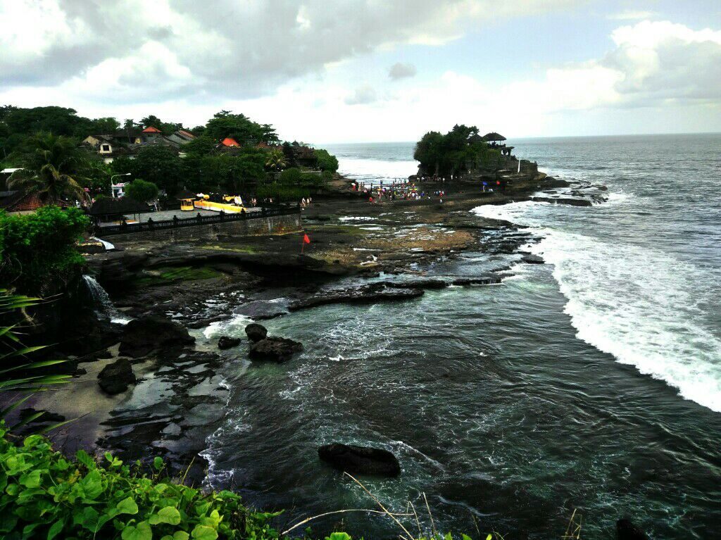 The rocky, wave-battered coast around Tanah Lot from above.