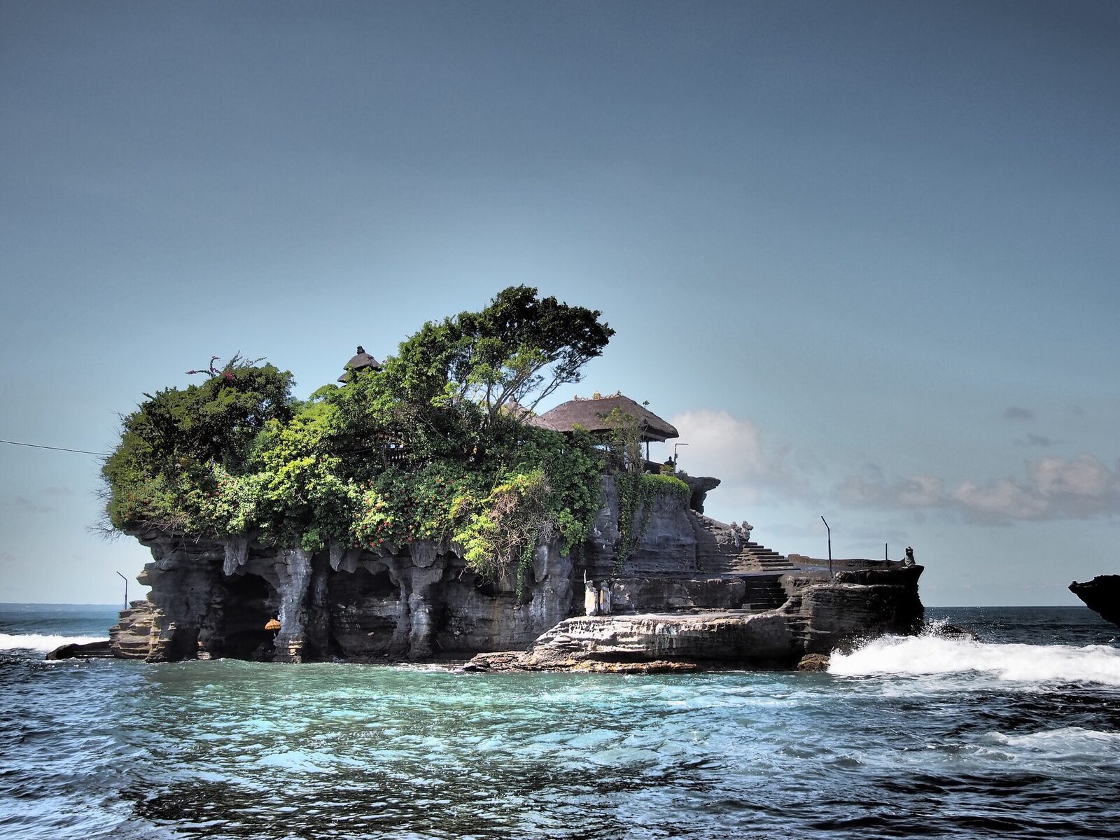Tanah Lot, the sea temple on its own rock — the classic break in the long drive up Bali's west coast.