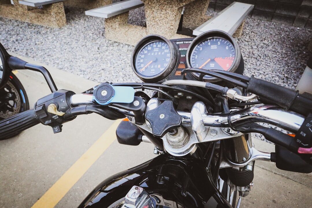 A phone mounted on a scooter's handlebars out on the road — so you're following the map hands-free instead of one-handing it at 40kph.