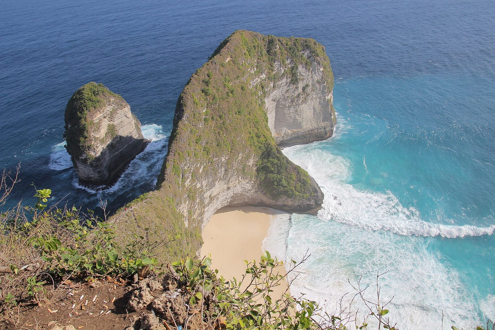 Kelingking Beach on Nusa Penida — the T-Rex headland and impossible-blue cove that fills every Bali feed. Wonderful for a few nights; a rough place to base a whole trip.