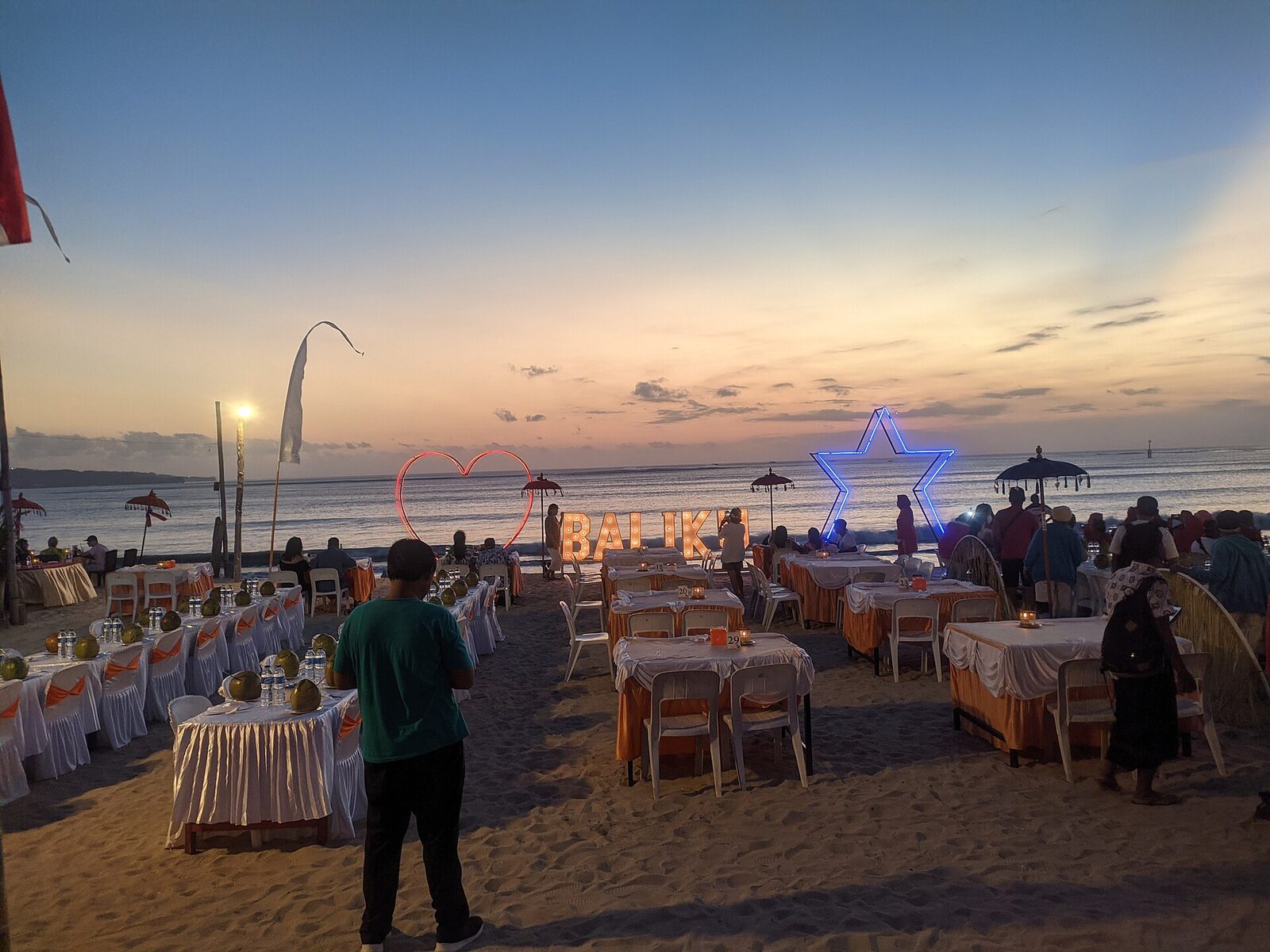 Seafood tables set out on the sand at Jimbaran, waiting for the evening grill crowd.