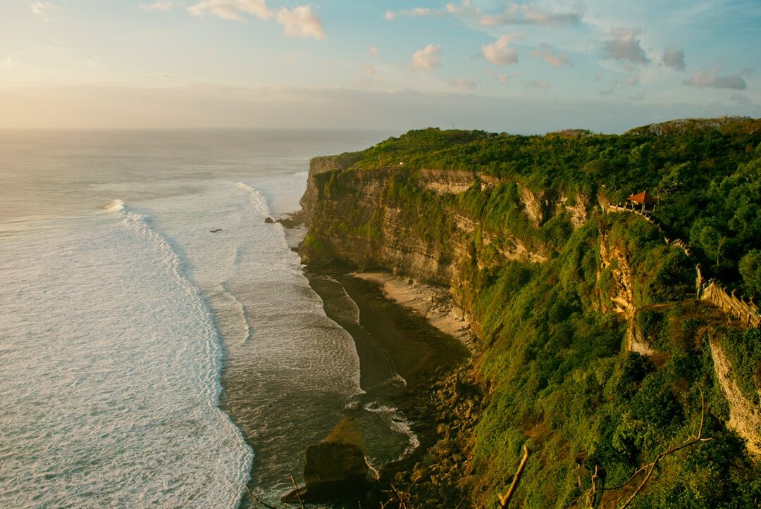 Green-topped cliffs plunging to the surf along the peninsula's coast.